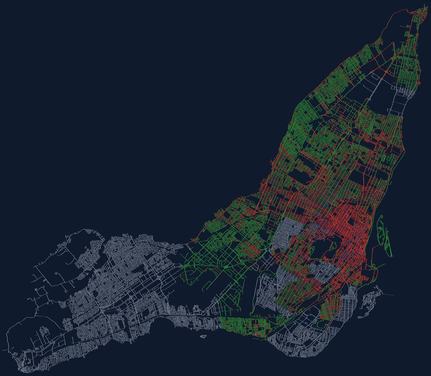 Toute l’île de Montréal dans Stationne : 128 784 côtés de rue colorés selon leur règle, et en gris hachuré les secteurs incertains de l’ouest de l’île