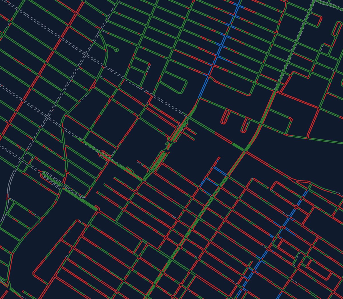 Carte Stationne d’un quartier de Montréal : chaque côté de rue coloré en vert (légal), rouge (interdit), bleu (payant) ou gris hachuré (incertain)